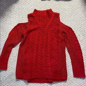 Woman’s turtleneck red cold shoulder sweater